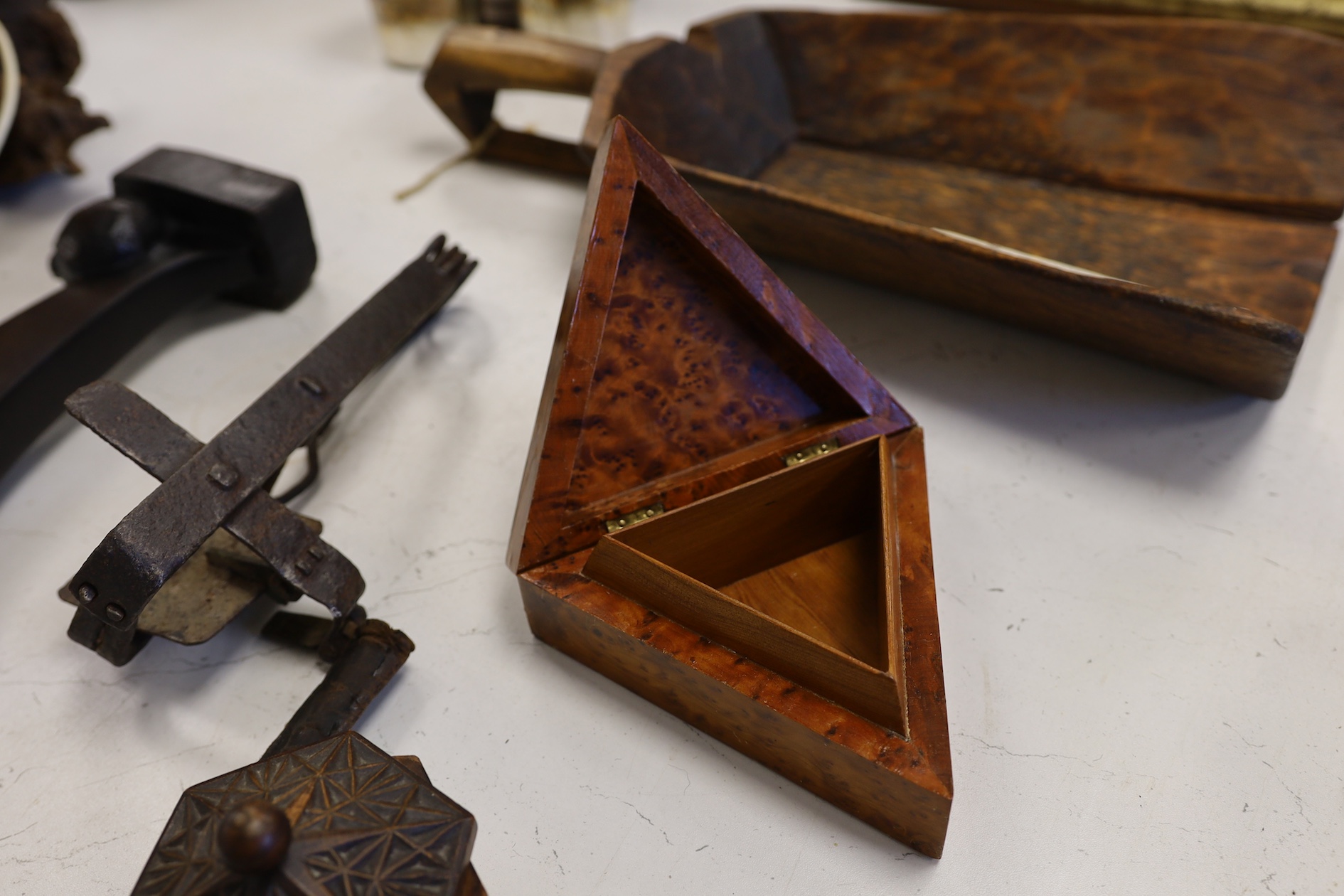 A wrought iron animal trap, a Durham Cathedral style door knocker back plate, a diamond tipped glass cutter and a group of Treen, tallest 42.5cm. Condition - fair to good